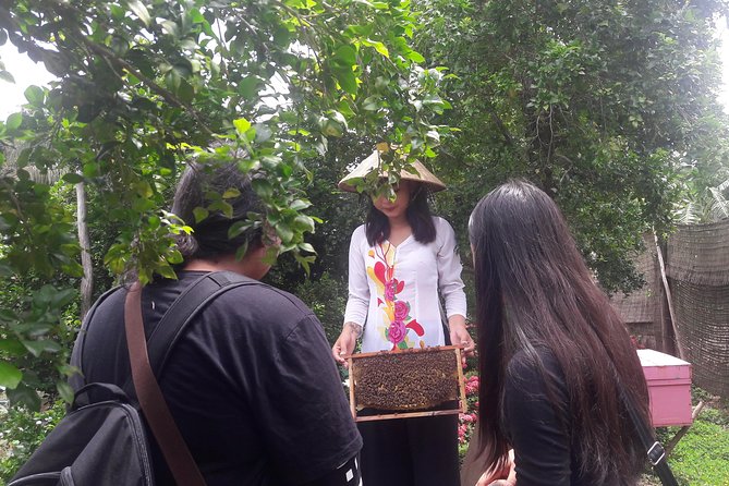 1-day Mekong Delta Tour: Cai Be Market, Local Island and Cycling - Cycling through Cai Be’s orchards