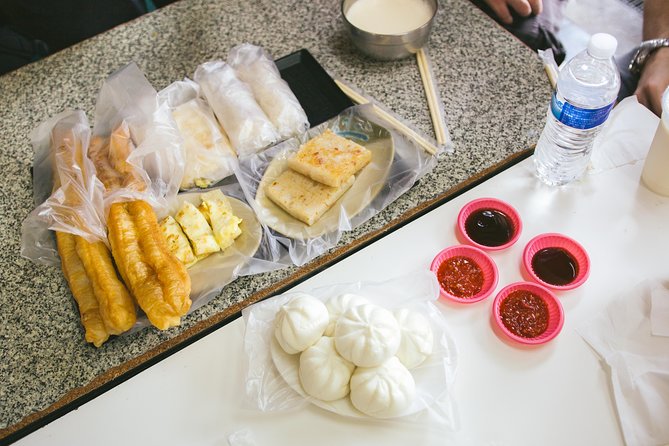 4-Hour Morning Cycling City Tour (incl. breakfast) - An old city gate and Chiang Kai-shek Memorial Hall