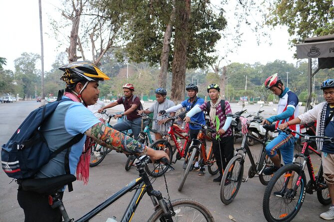 Angkor Sunrise Expedition Cycling Through Serene Backroads - Along the Angkor Thom wall