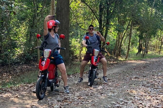 Angkor Wat Cycling Tour - Ta Prohm: trees, stone, and a famous atmosphere