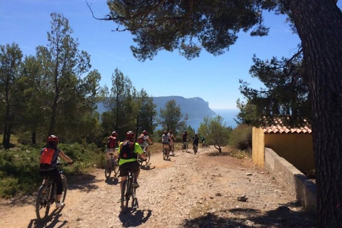 Cassis: Three Calanques Tour by Electric Mountain Bike - Riding from the village into the national park