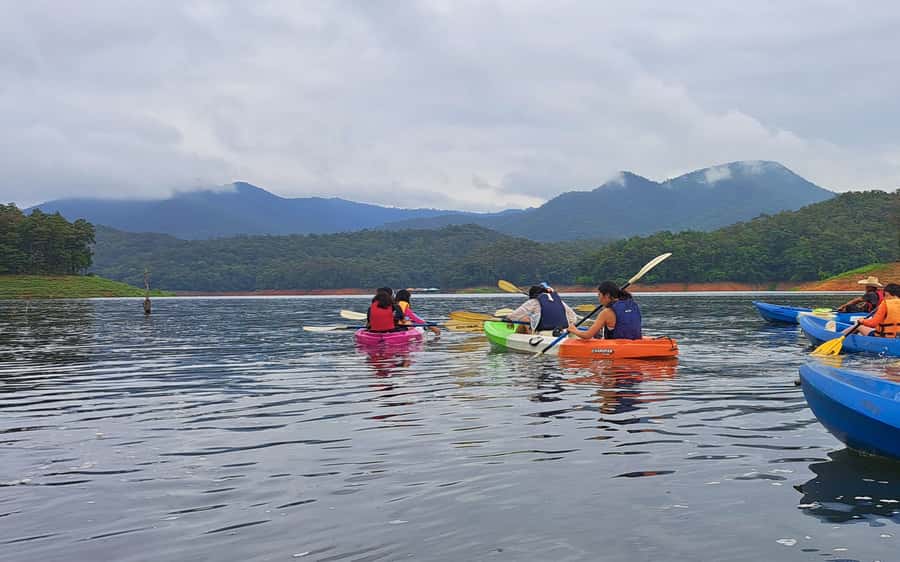 Chiang Mai: Sticky waterfall, lake kayak and cycling tour - A long-tail boat ride into Sri Lanna National Park