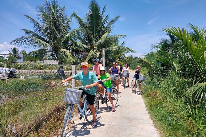 Cycling, Buffalo Ride and Basket Boat Tour in Hoi An - Coconut palms, fishing nets, and a bamboo basket boat