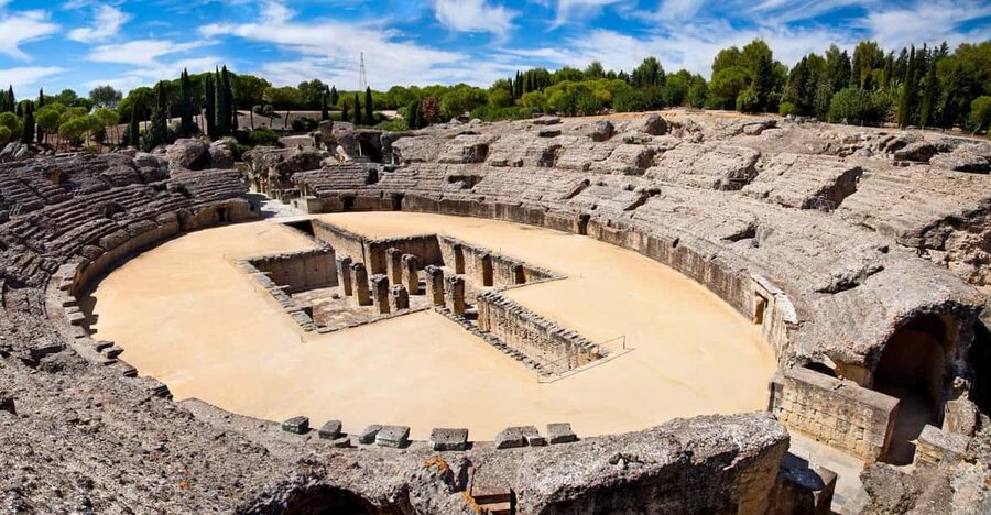 From Seville: Half-Day Guided Bike Trip to Italica - Walking Through Itálica’s Roman Houses