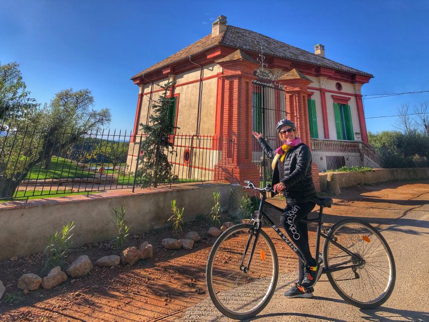 From Sitges: Paella Masterclass, Bike Ride and Winery Visit - Cooking paella from a family recipe
