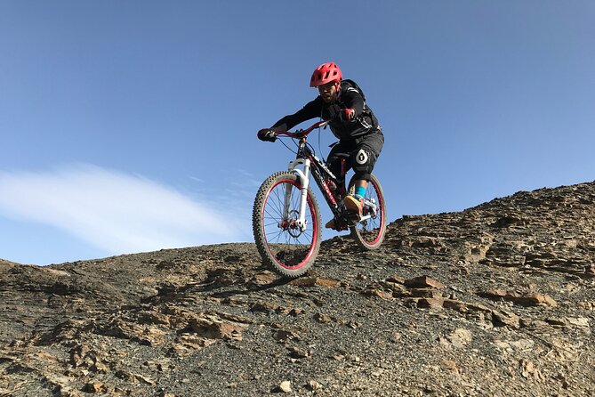 Full Day Private Mountain Bike Trip in the Atlas Mountains - Riding through villages and red mountain slopes