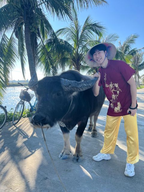 Funny day cycling, Buffalo riding and Basket boat - Cycling into Cam Thanh’s water coconut village
