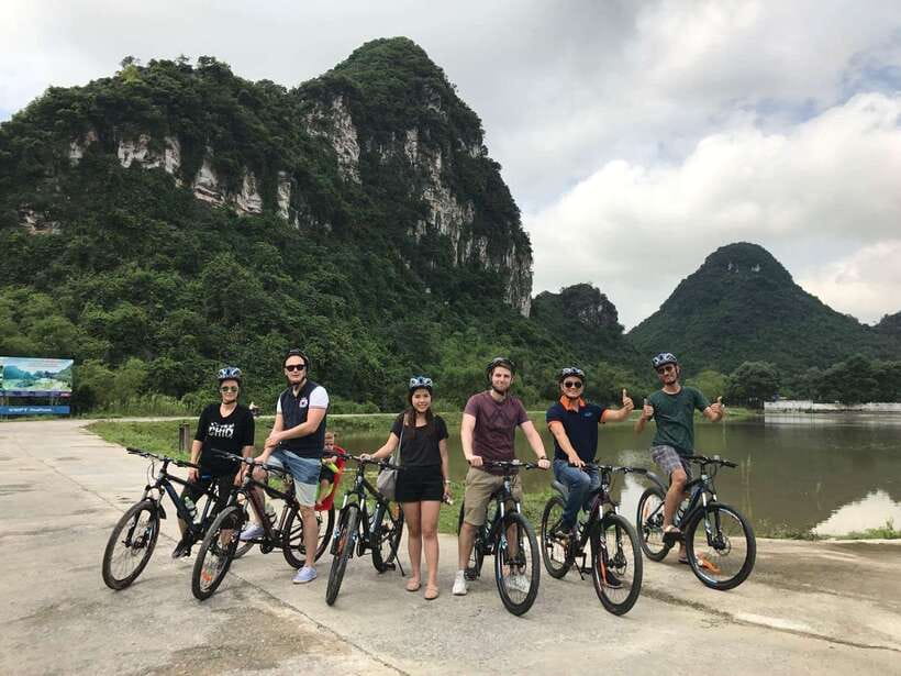 Hoa Lư and Tam Cốc with Bike Ride and Family Visit - Rowing through Tam Coc’s caves