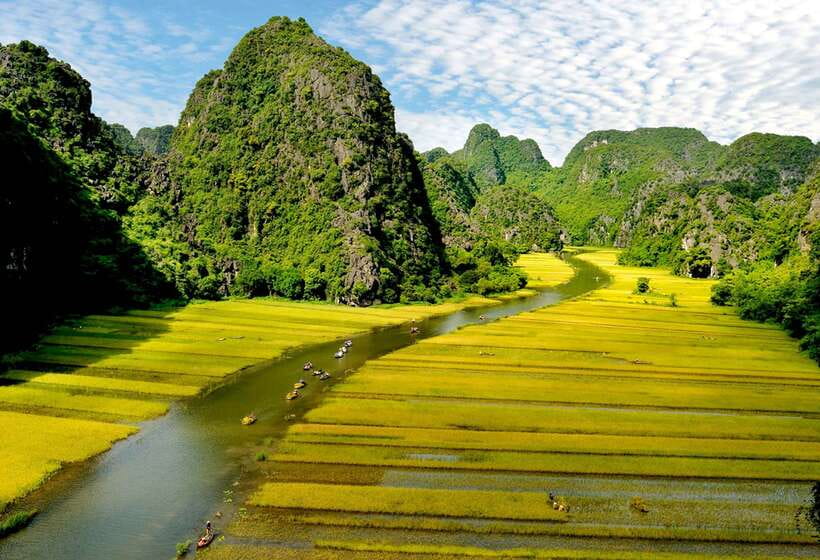 Hoa Lư and Tam Cốc with Bike Ride and Family Visit - Cycling past Tam Coc’s rice fields