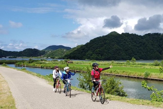 Kinosaki Onsen Cycling Tour Kinosaki & Riverside Experience - Along the river, where town gives way to fields