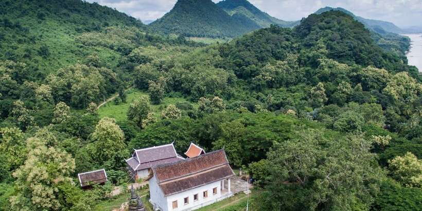 Luang Prabang: Pottery Workshop & Wat Chomphet cycling Tour - Riding through quiet Chomphet district