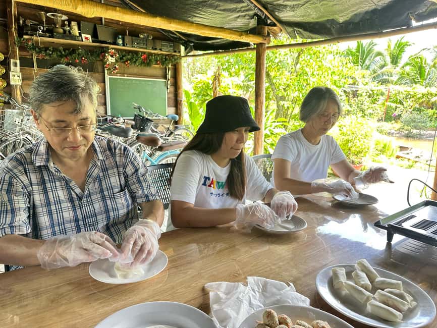 Mekong Delta Day Trip: Explore Cycling & Cook Classes Farm - The hand-rowed sampan through small canals