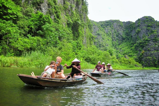 Ninh Binh Full-Day Tour Hoa Lu Tam Coc Cycling, Boat,Buffet Lunch - Rowing through Tam Coc’s three caves