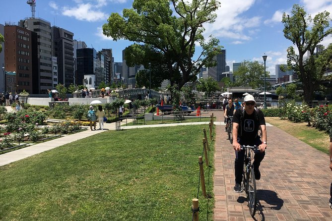 One-Day Osaka Bike Adventure: 5–6 Hours - Osaka Castle Park, photos, and a little hill