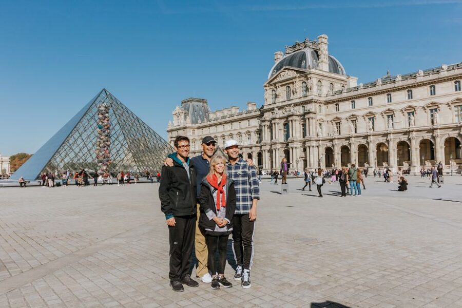 Paris: Famous Monuments Cycling Tour - Entering the Louvre courtyards by bicycle