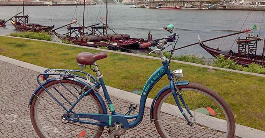 Porto: Self-Guided Bike and Boat Tour with Port Wine Tasting - Crossing Dom Luis I Bridge into Gaia