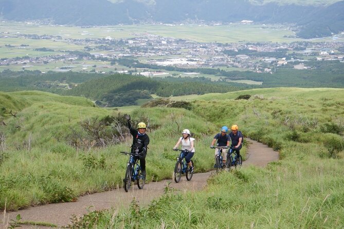 Private E-MTB guided cycling around Mt. Aso volcano & grasslands - The downhill view across Aso’s caldera