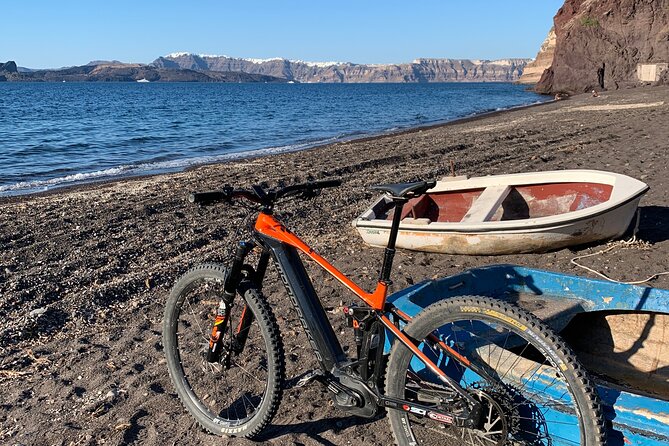 Private Electric Mountain Bike Experience and Tour in Santorini - Red lava rock above Kerkezou Beach