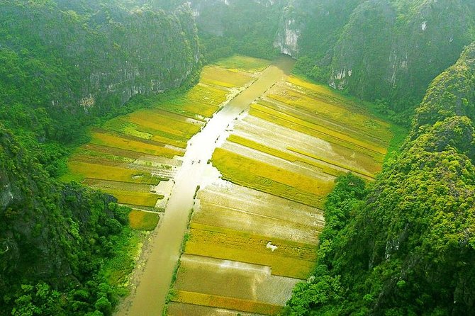 Private Tour: Hoa Lu and Tam Coc Boat and Bike Day Trip from Hanoi - Rowing beneath Tam Coc’s limestone towers