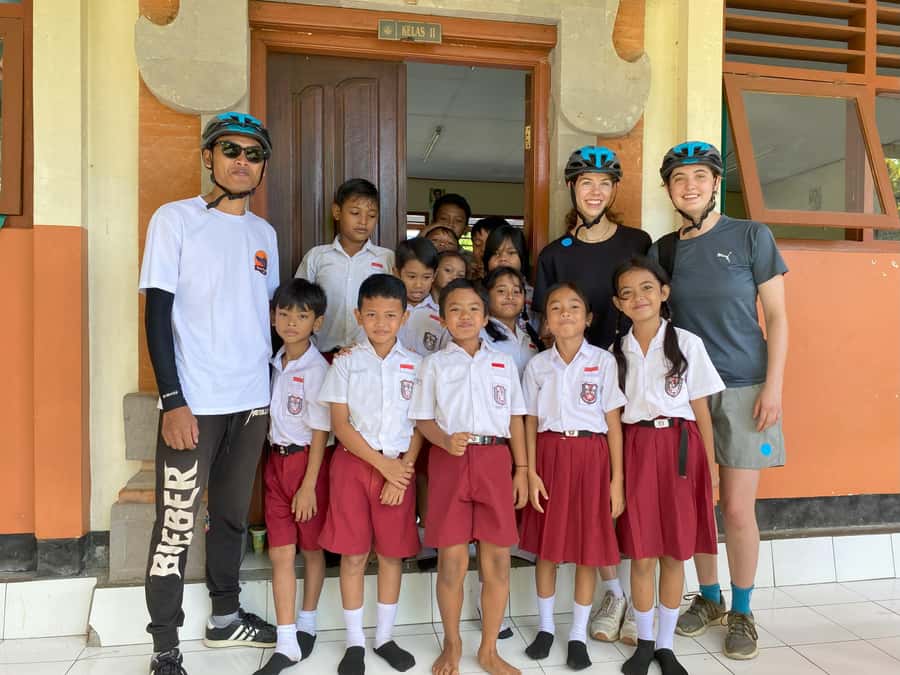 Ubud: Kintamani Downhill Cycling with small group & Private - Pausing at a village temple